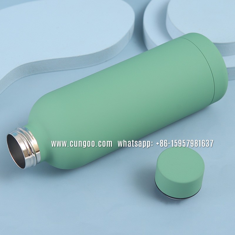 Vacuum flask has two walls and there a vacuum space between two walls plus coating layers
